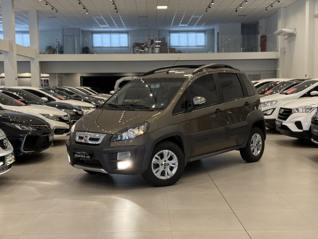 O FIAT-IDEA ADVENTURE 1.8 16V Dualogic ou Manual (modelo 2014) é um dos representantes mais icônicos de uma era em que o mercado brasileiro era absolutamente fascinado pela estética off-road urbana. Lançado originalmente em meados dos anos 2000 e atualizado ao longo dos anos, o modelo 2014 traz o amadurecimento visual e mecânico dessa minivan com alma de jipe.